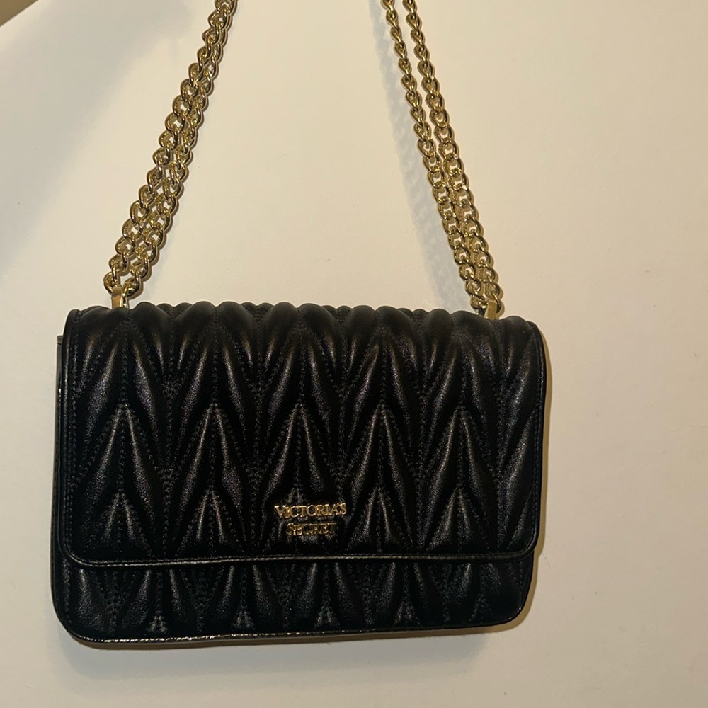 Victoria’s Secret leather bag in color black medium size with adjustable strap